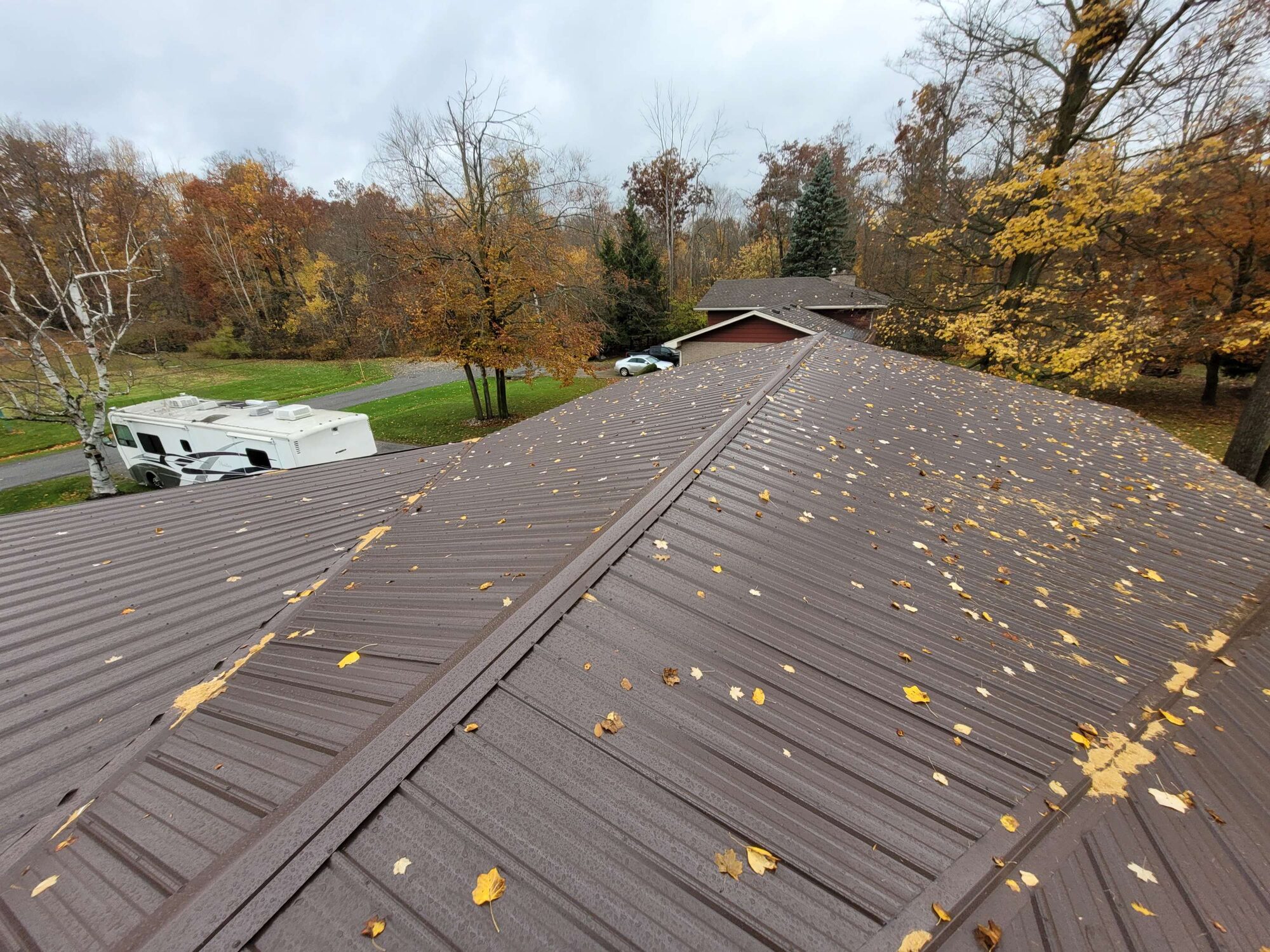 Standing seam metal roofing panels on a residential roofline